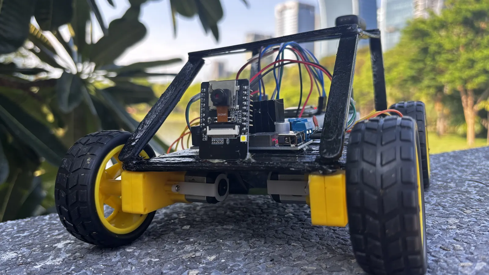 Low-angle view of the student-built Wi-Fi controlled RC car and its electronics