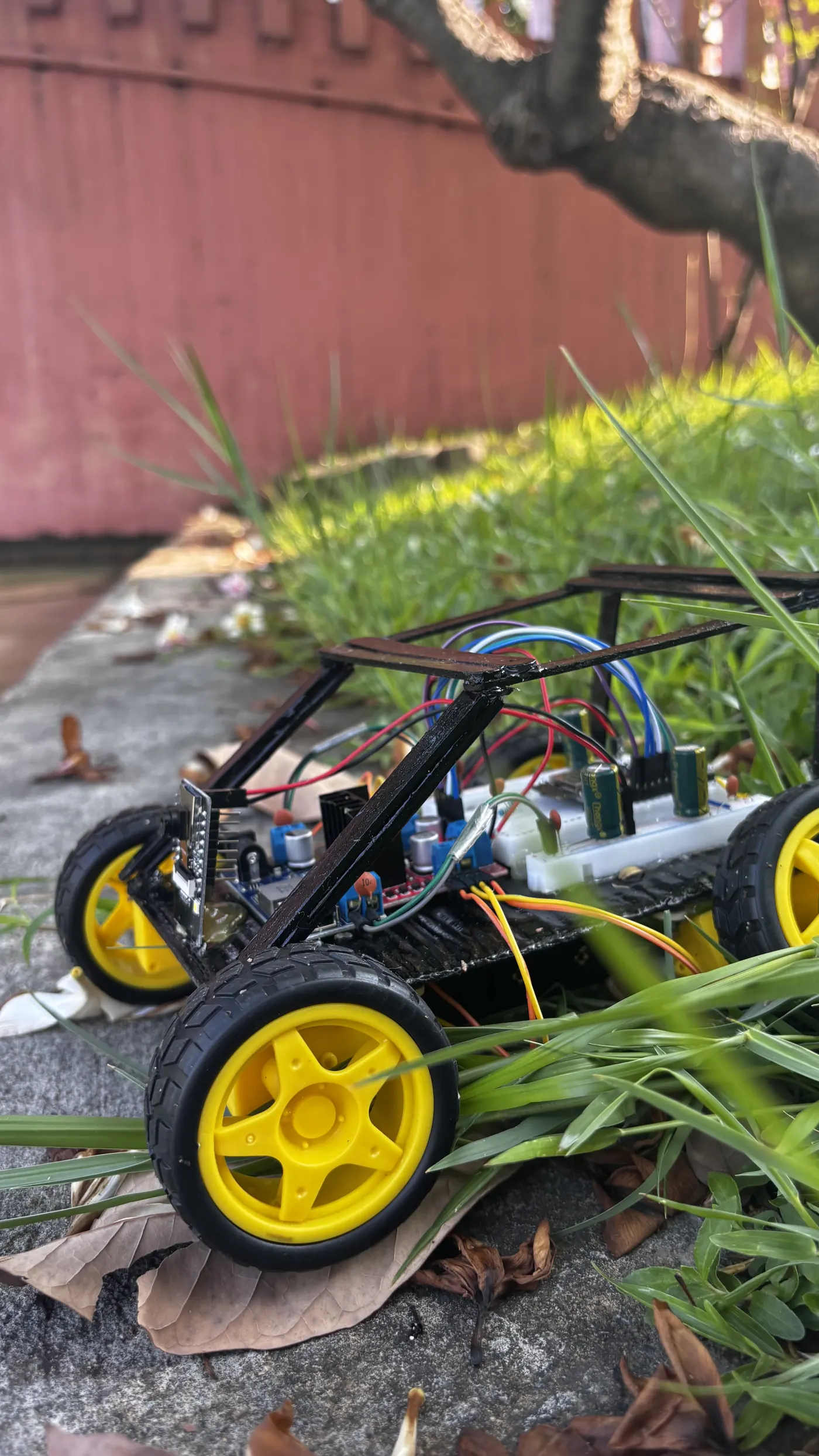 Student-built Wi-Fi controlled RC car with its wiring and chassis